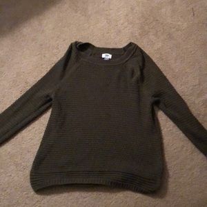 a olive green sweater